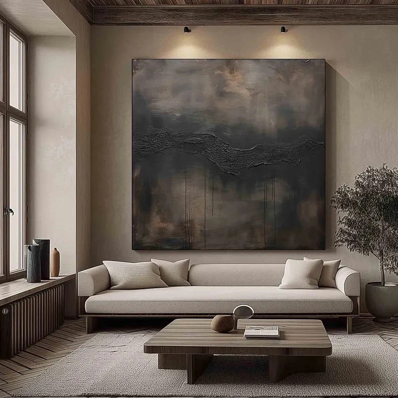 a modern living room with a large abstract painting on the wall, a white sofa, a wooden coffee table, and a large window.
