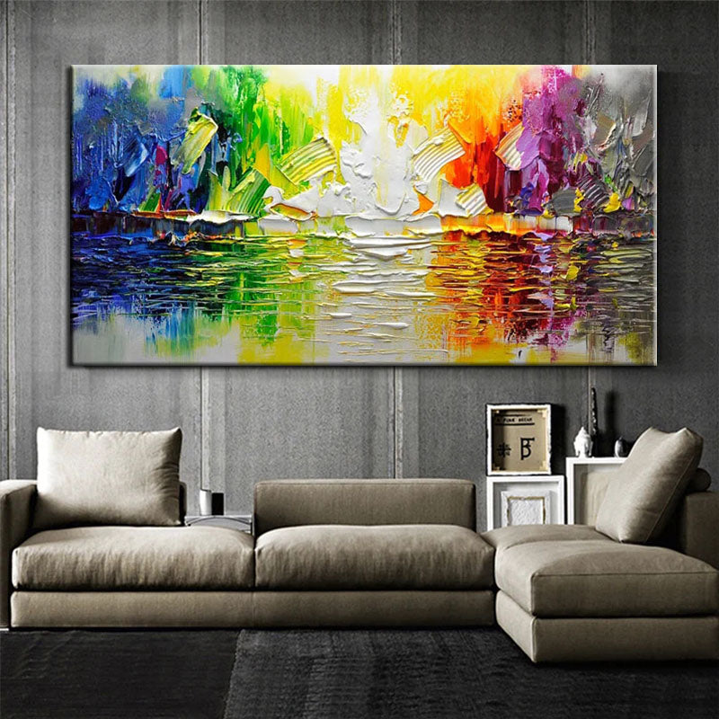 a living room with a couch and a painting on the wall