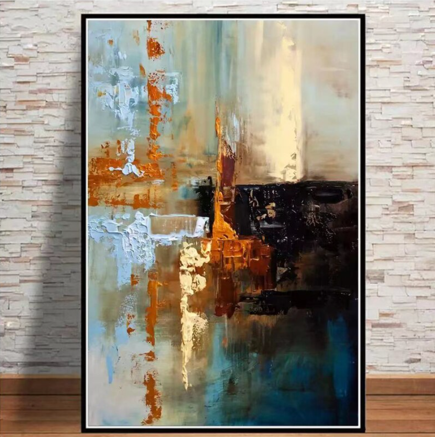 a painting hanging on a wall next to a brick wall