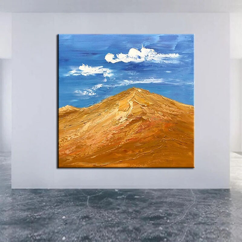 a painting of a mountain in a room