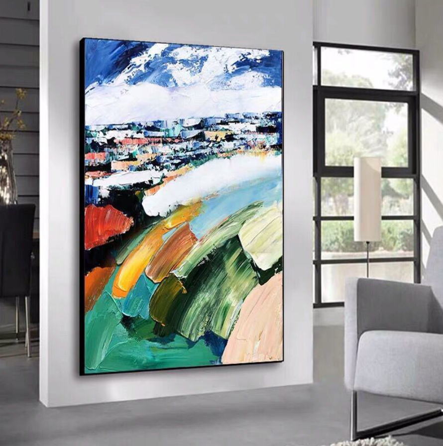 a painting hanging on a wall in a living room