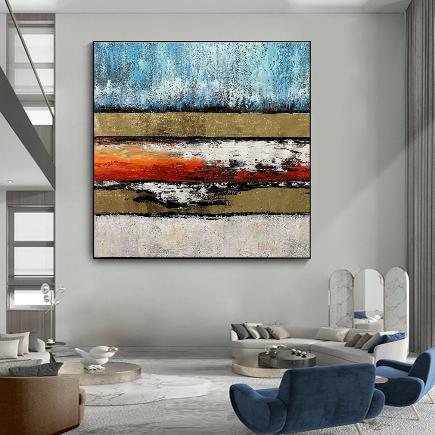 a living room filled with furniture and a painting on the wall