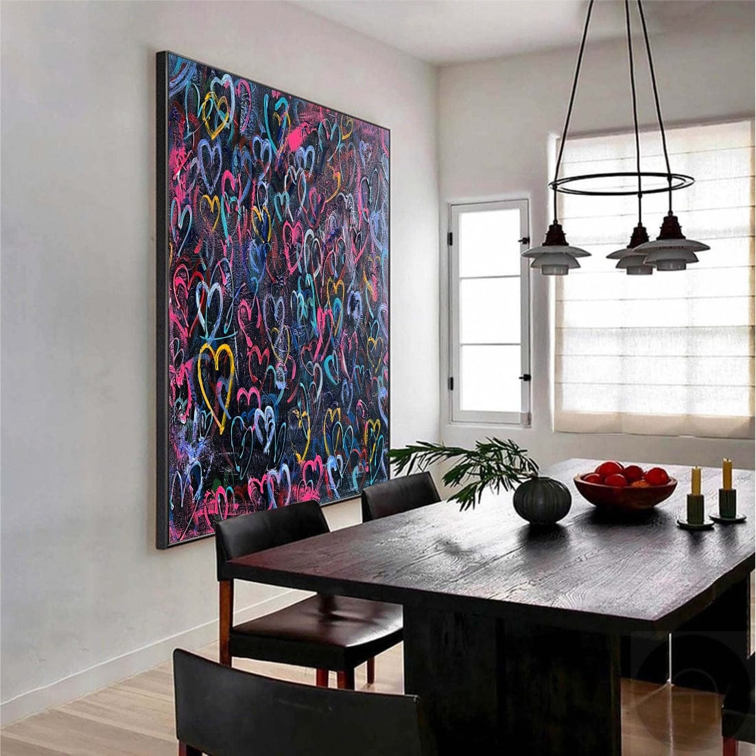 a dining room with a large painting on the wall