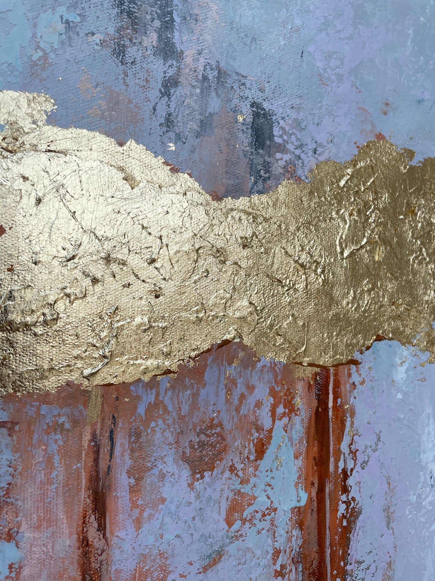 a close up of a painting with gold paint