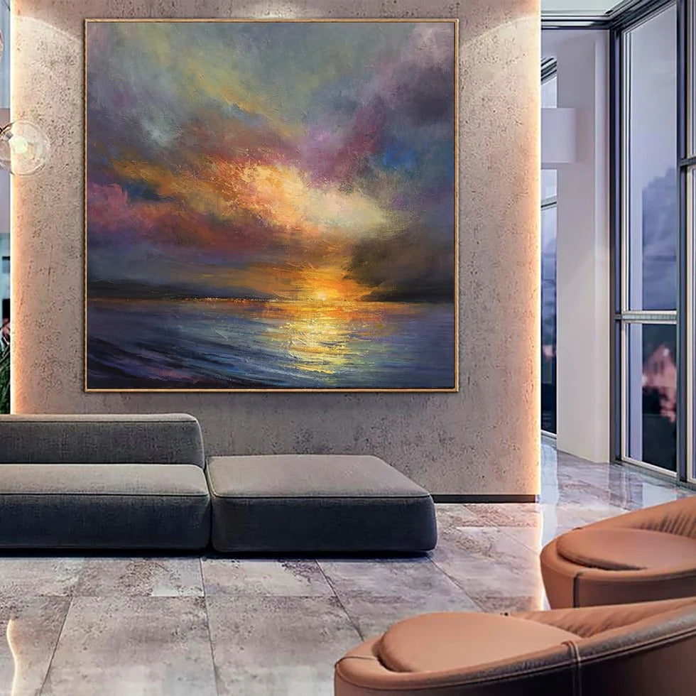 a large, colorful painting of a sunset over the ocean, which is displayed on the wall in a modern living room setting.