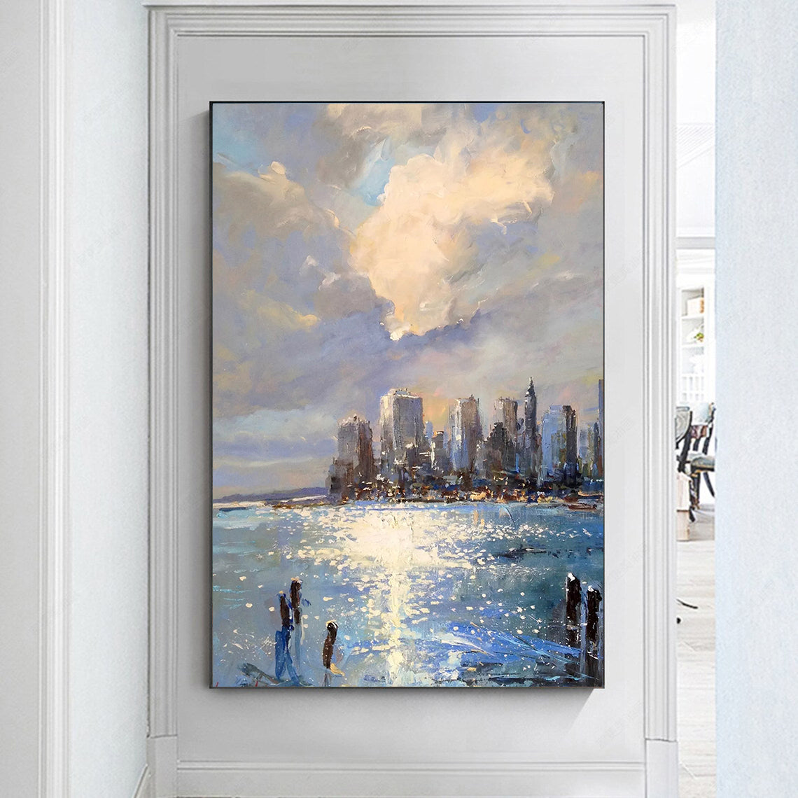 a painting hanging on a wall of a cityscape