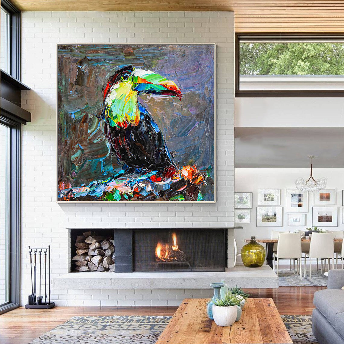 a living room with a large painting of a toucan on the wall