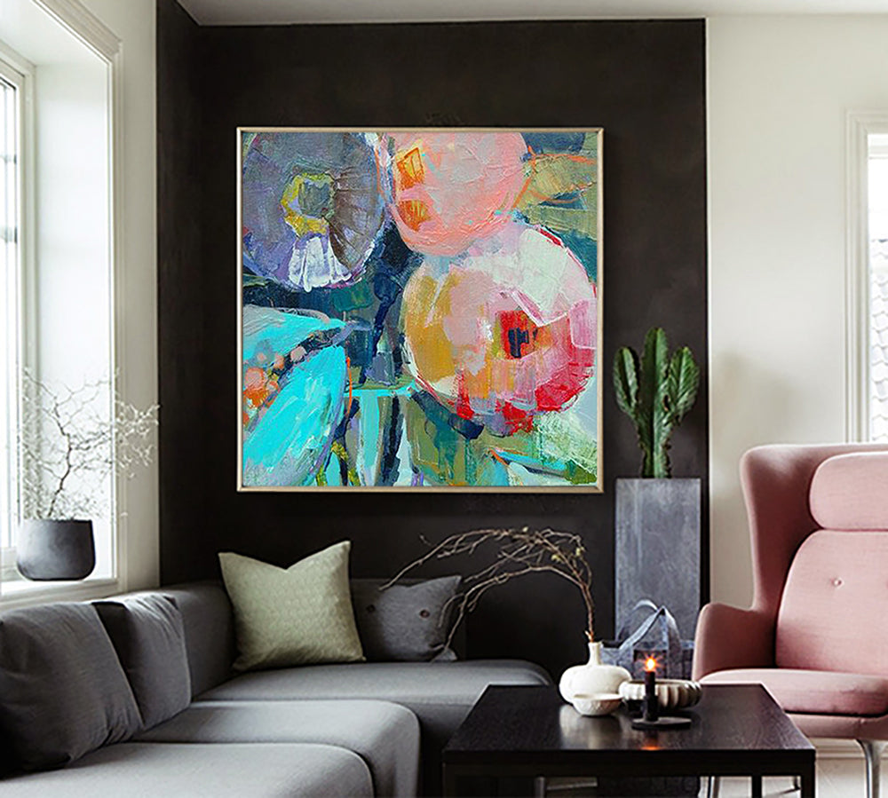 a living room filled with furniture and a painting on the wall