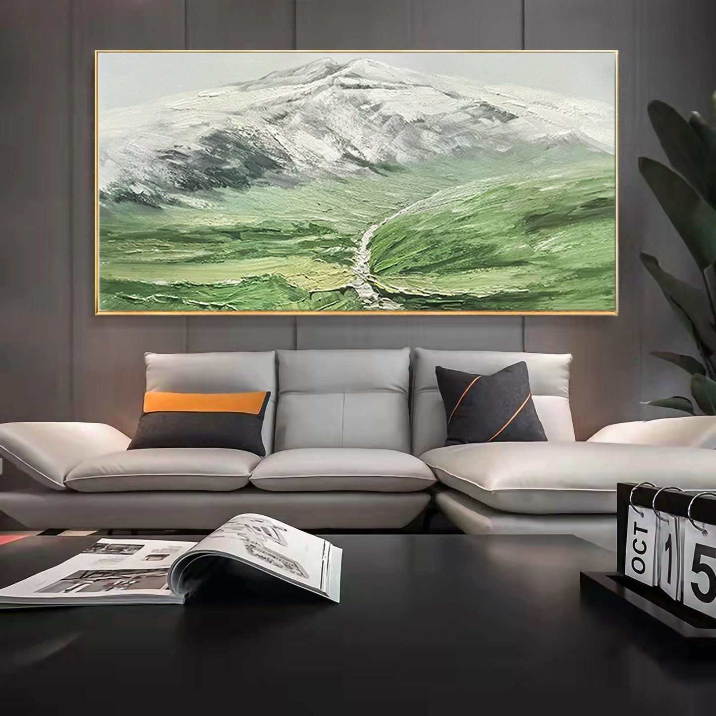 a living room with a large painting on the wall