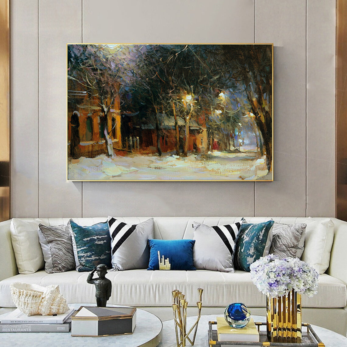 a living room filled with furniture and a painting on the wall