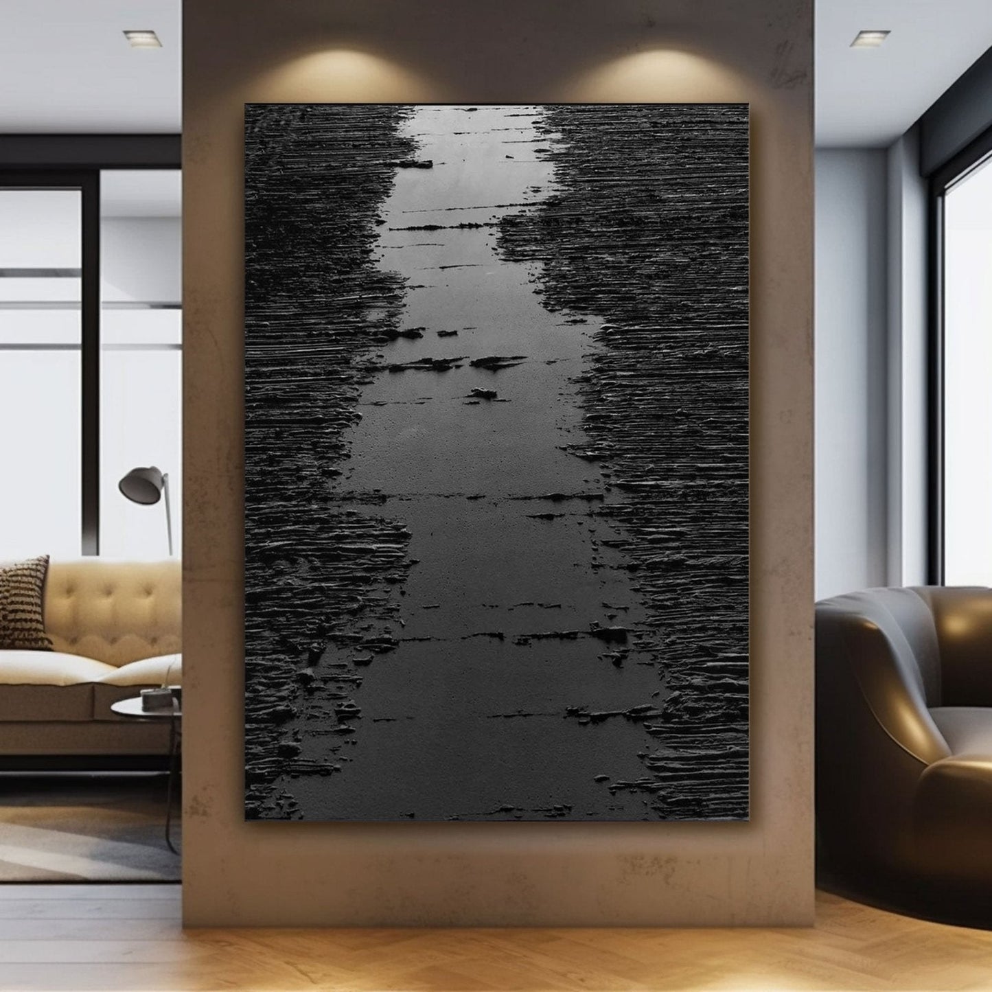 a large black and white abstract painting hanging on a wall in a modern living room.