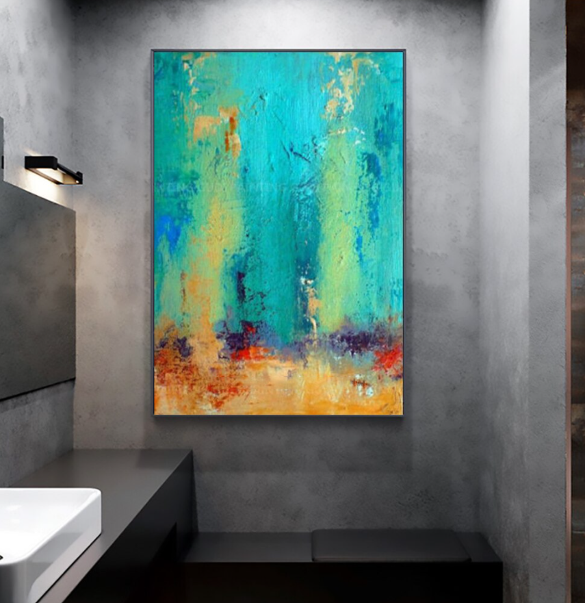 a painting hanging on a wall in a bathroom