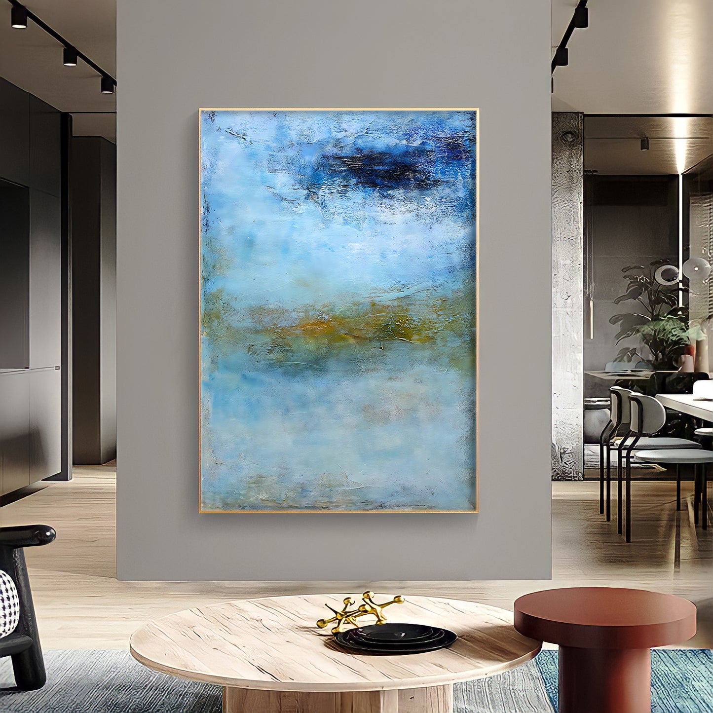 a painting hanging on a wall in a living room