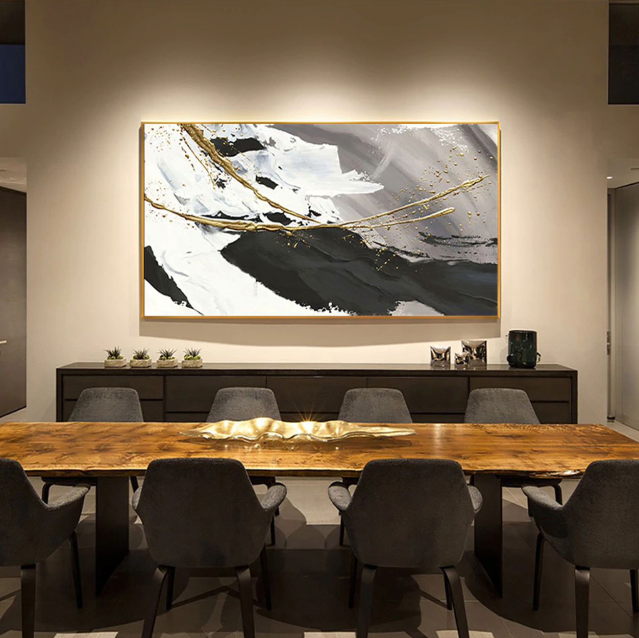 a dining room with a large painting on the wall