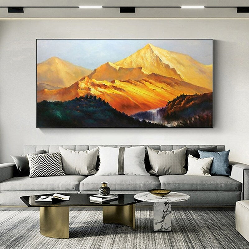 a living room filled with furniture and a painting on the wall