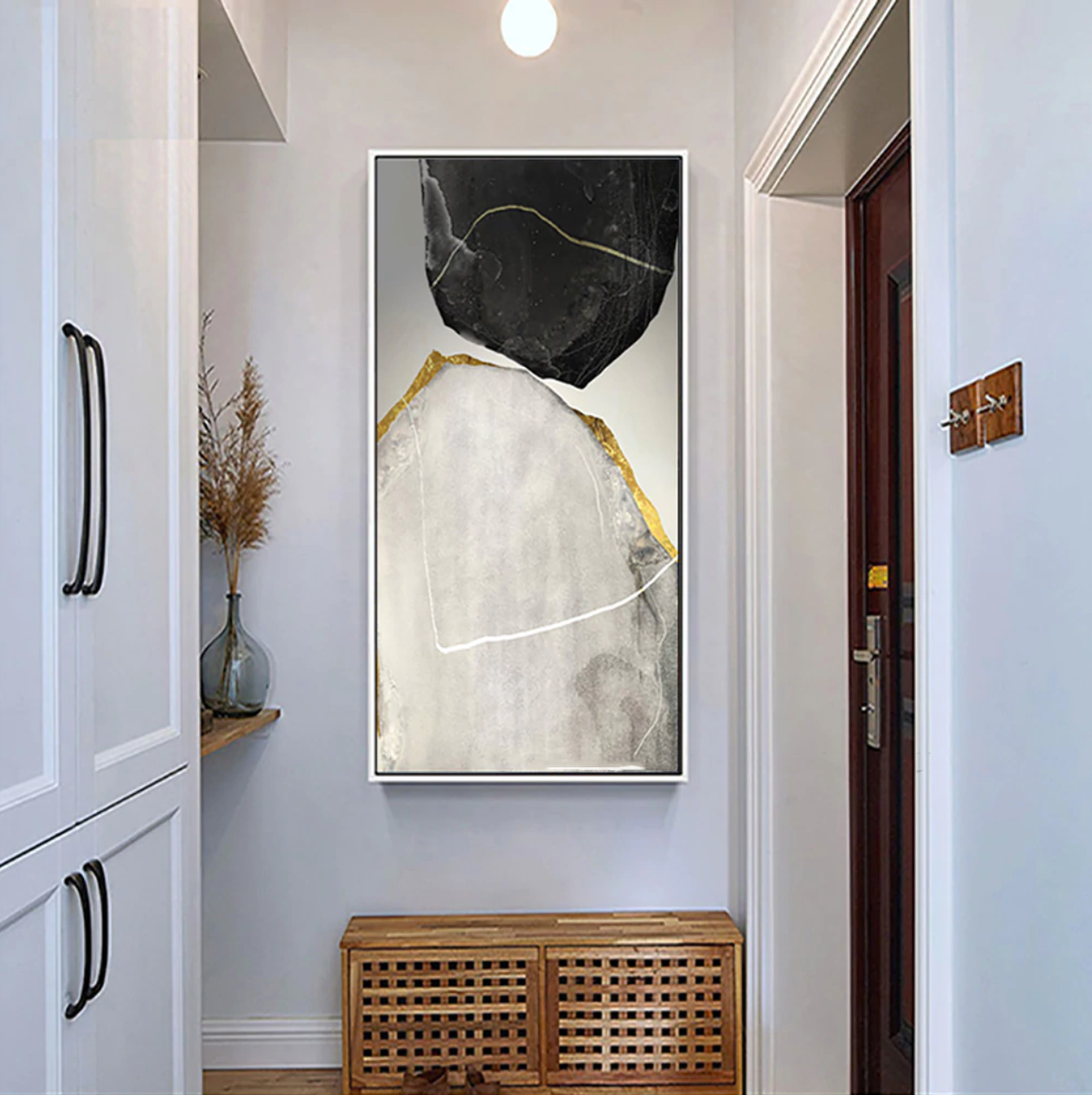 a hallway with a bench and a painting on the wall