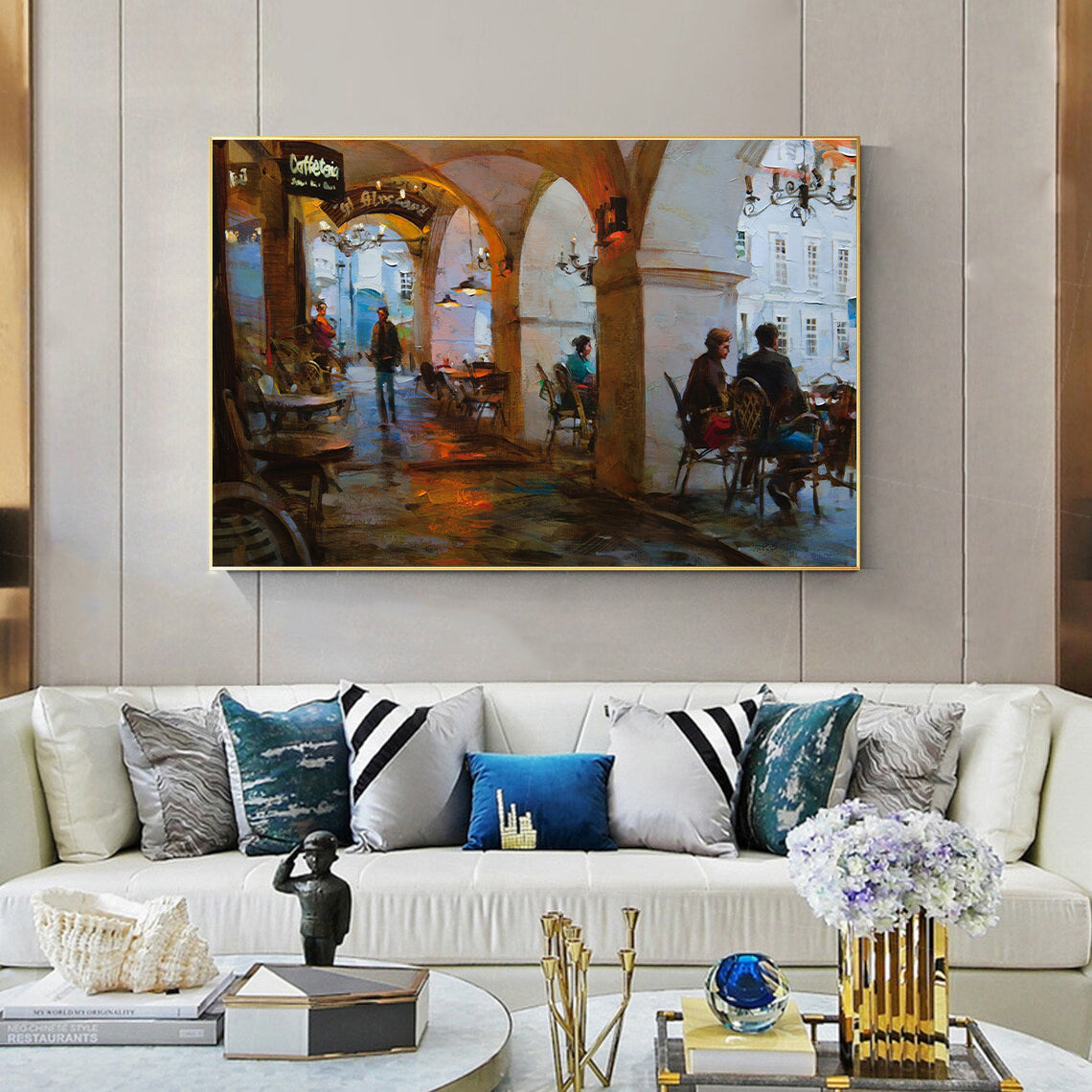 a living room filled with furniture and a painting on the wall