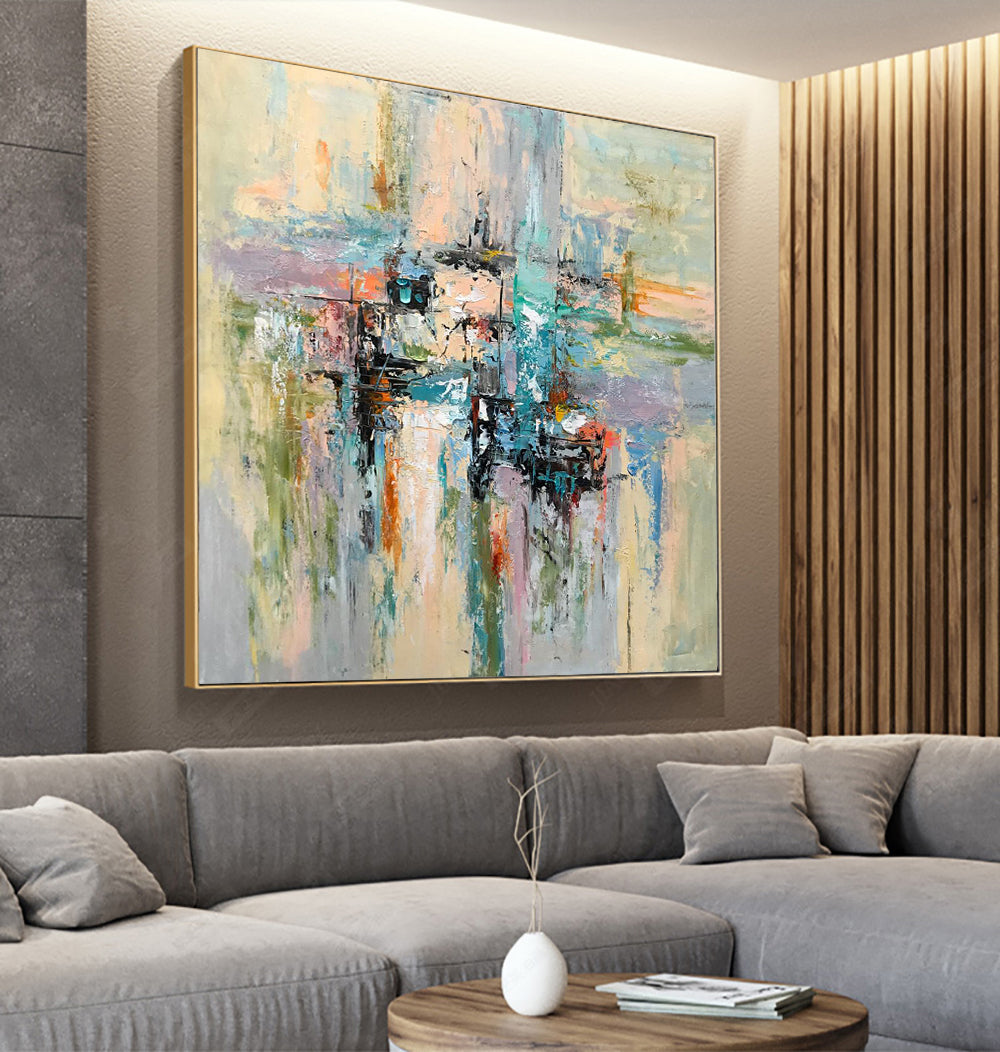 a living room with a large painting on the wall