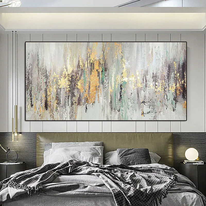 a large painting hanging above a bed in a bedroom