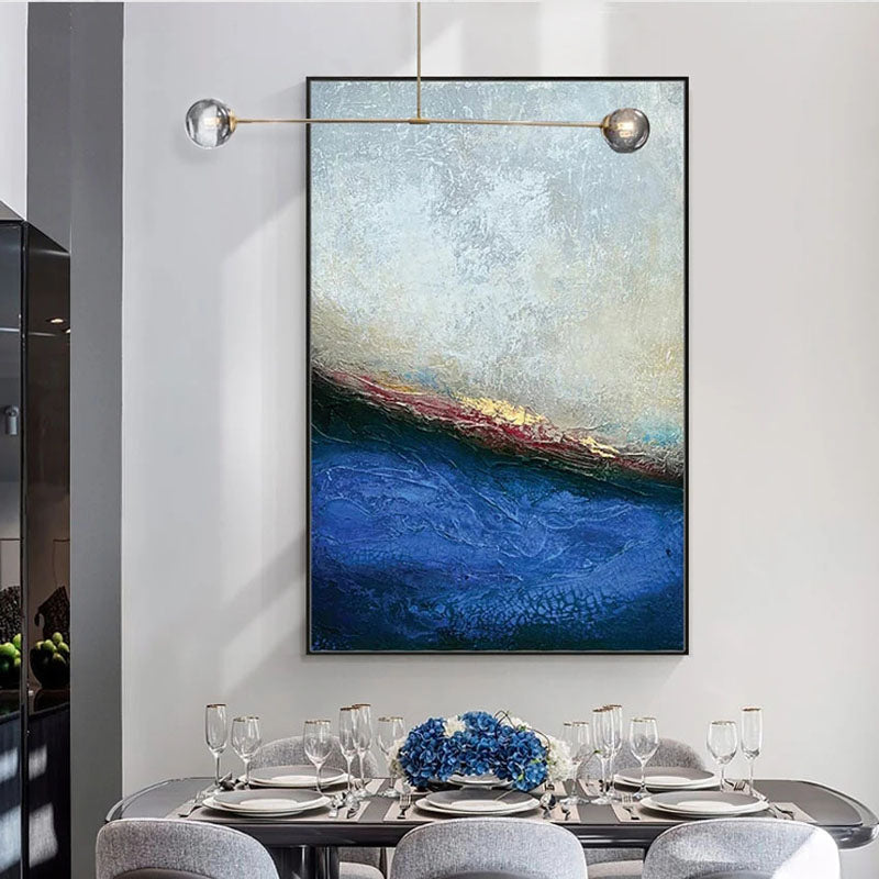 a dining room table with chairs and a painting on the wall