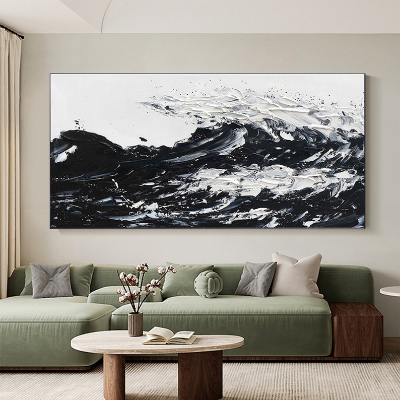 a living room with a large painting on the wall