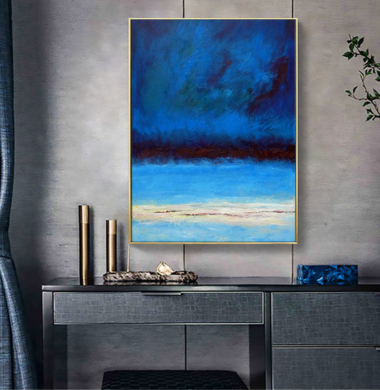 a painting hanging on a wall above a table