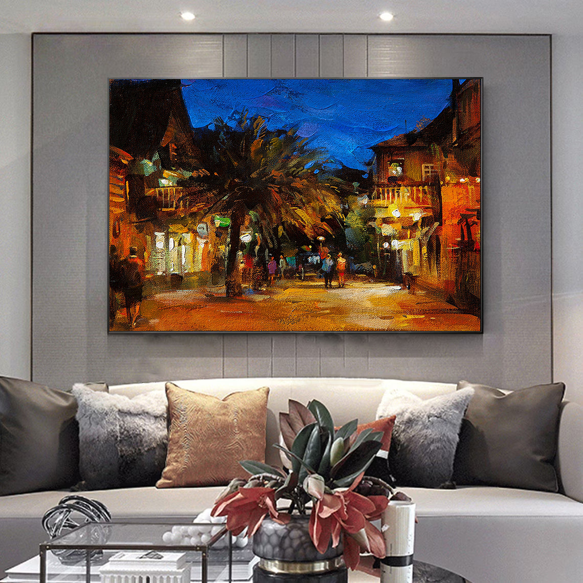 a living room with a couch and a painting on the wall