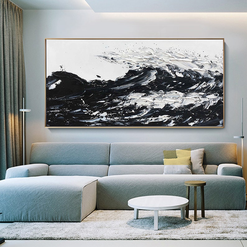 a living room with a large painting on the wall