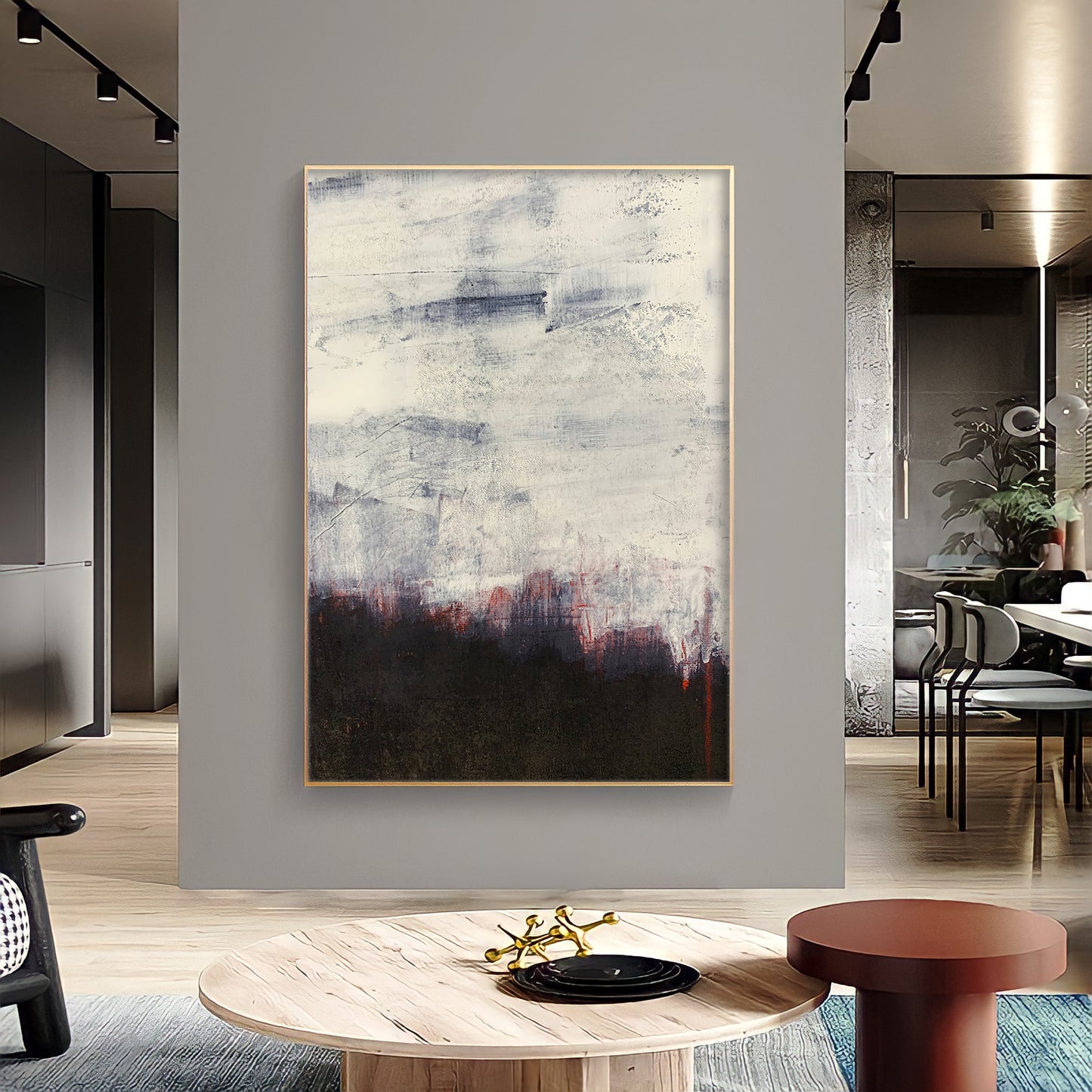 a living room with a large painting on the wall