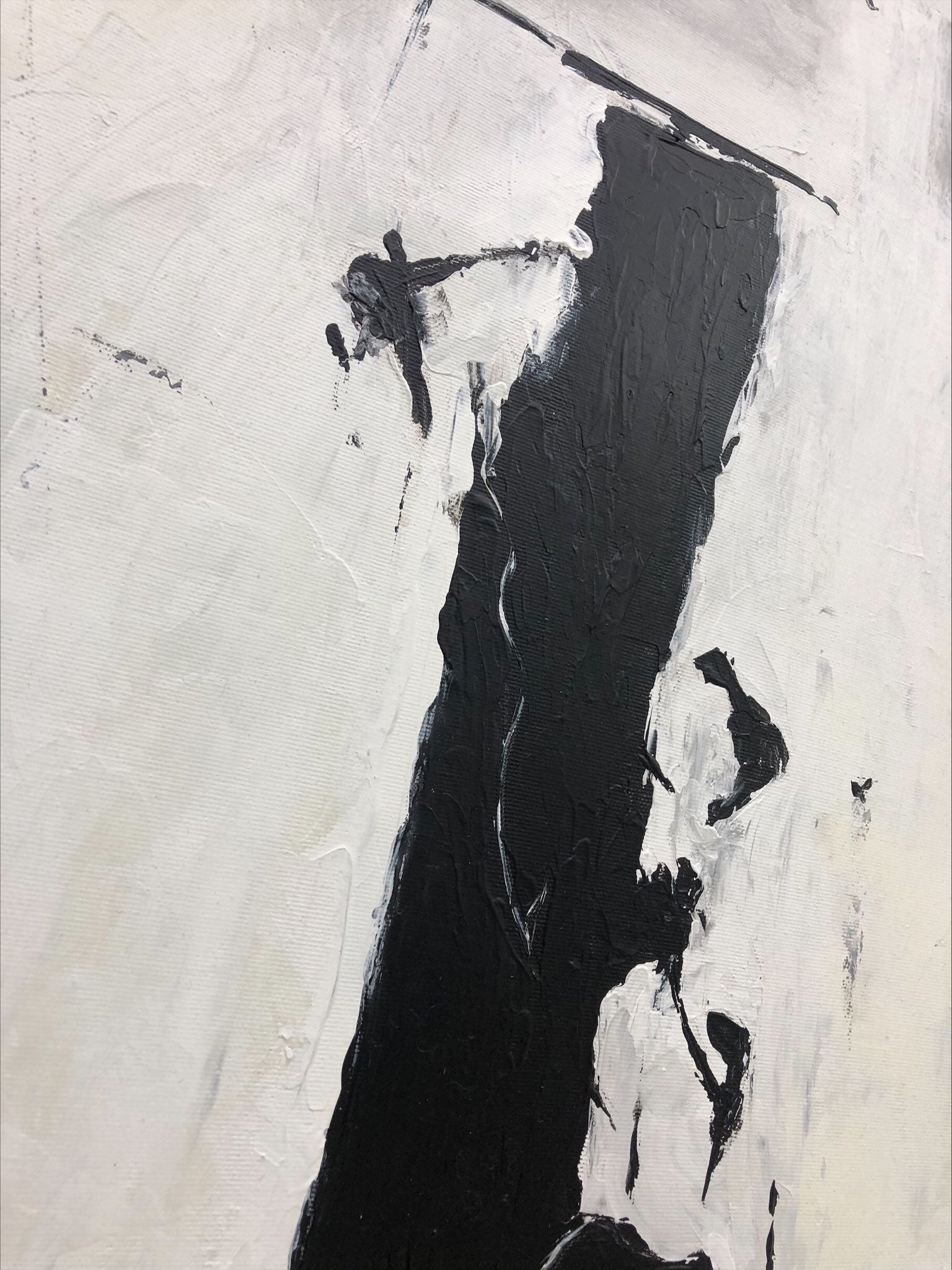 a painting with black and white paint on it