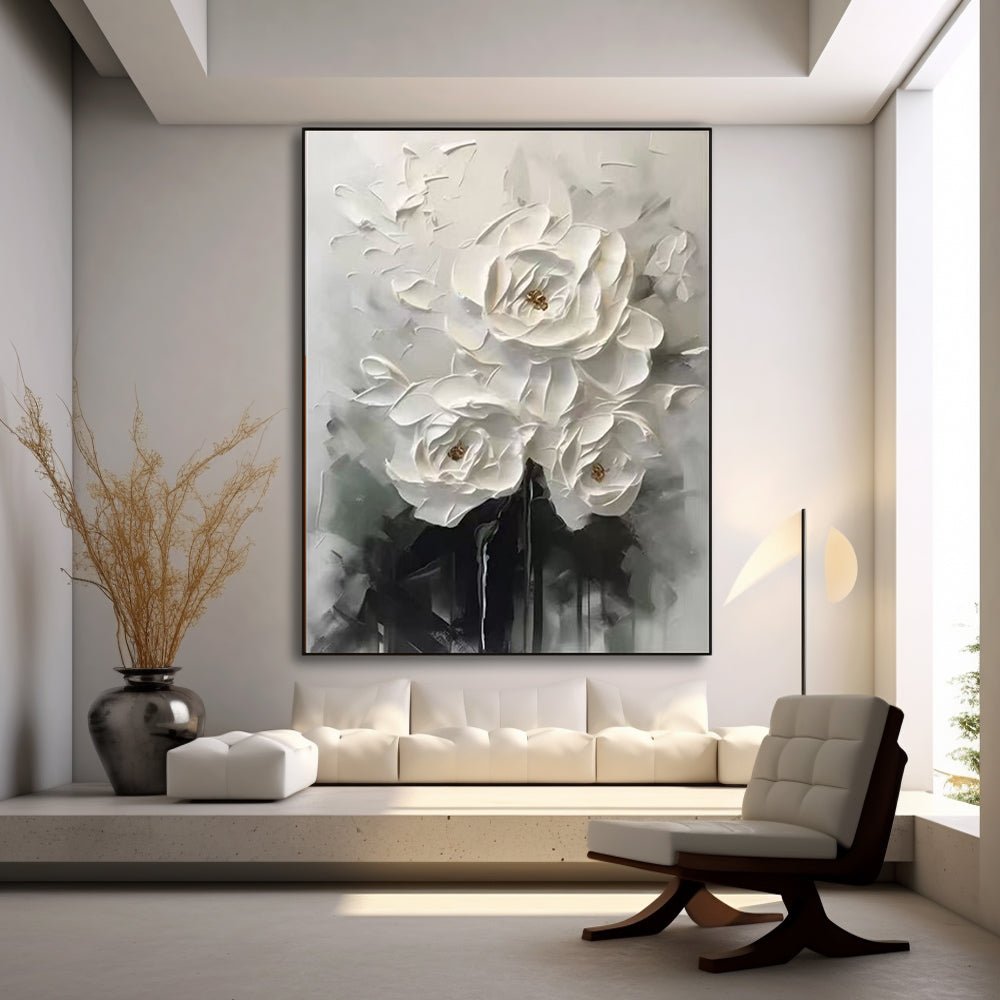 a modern living room with a large white floral painting hanging on the wall, a white sofa, a wooden chair, and a large window.