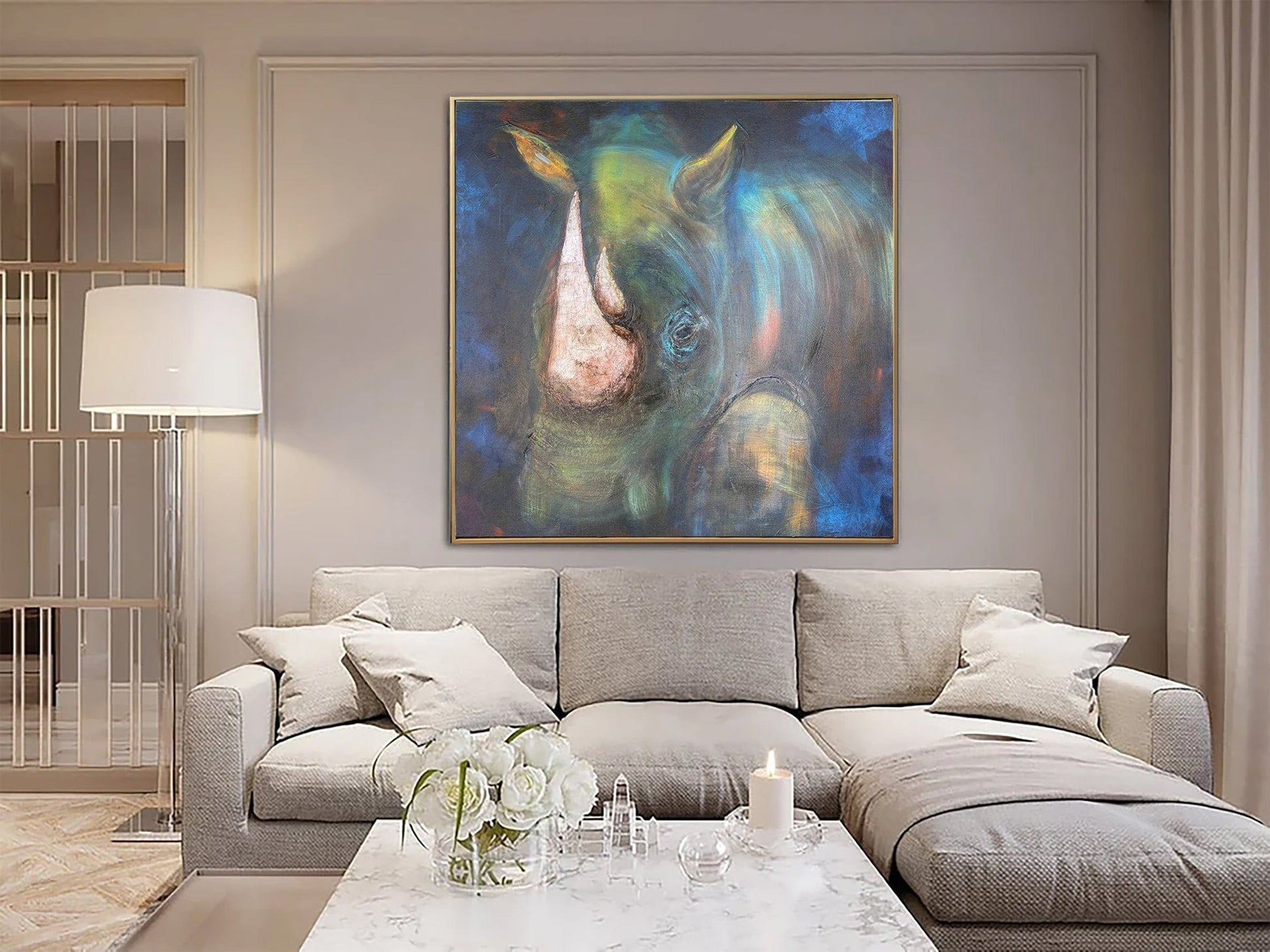 a living room with a large painting on the wall