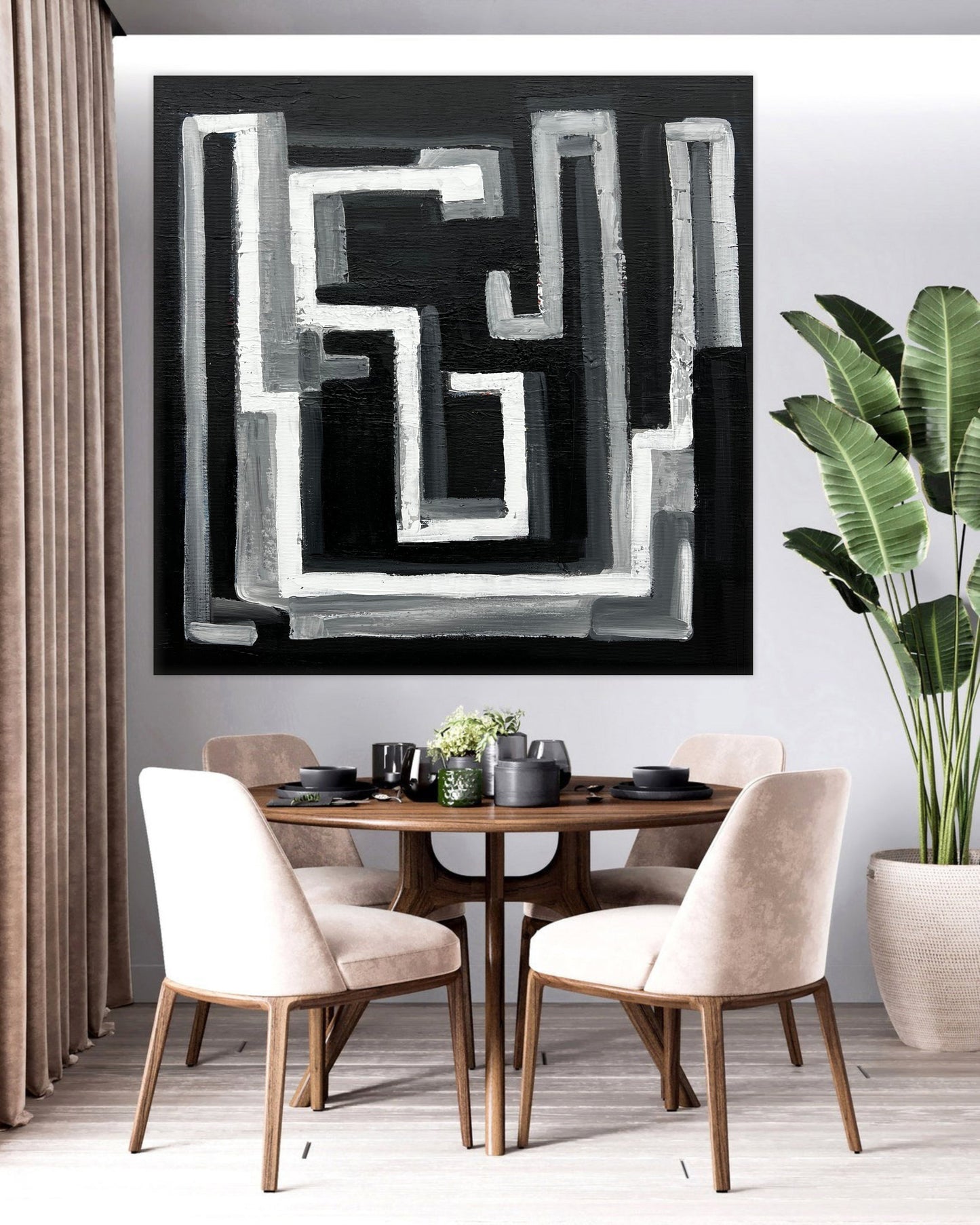 a dining room table with chairs and a painting on the wall