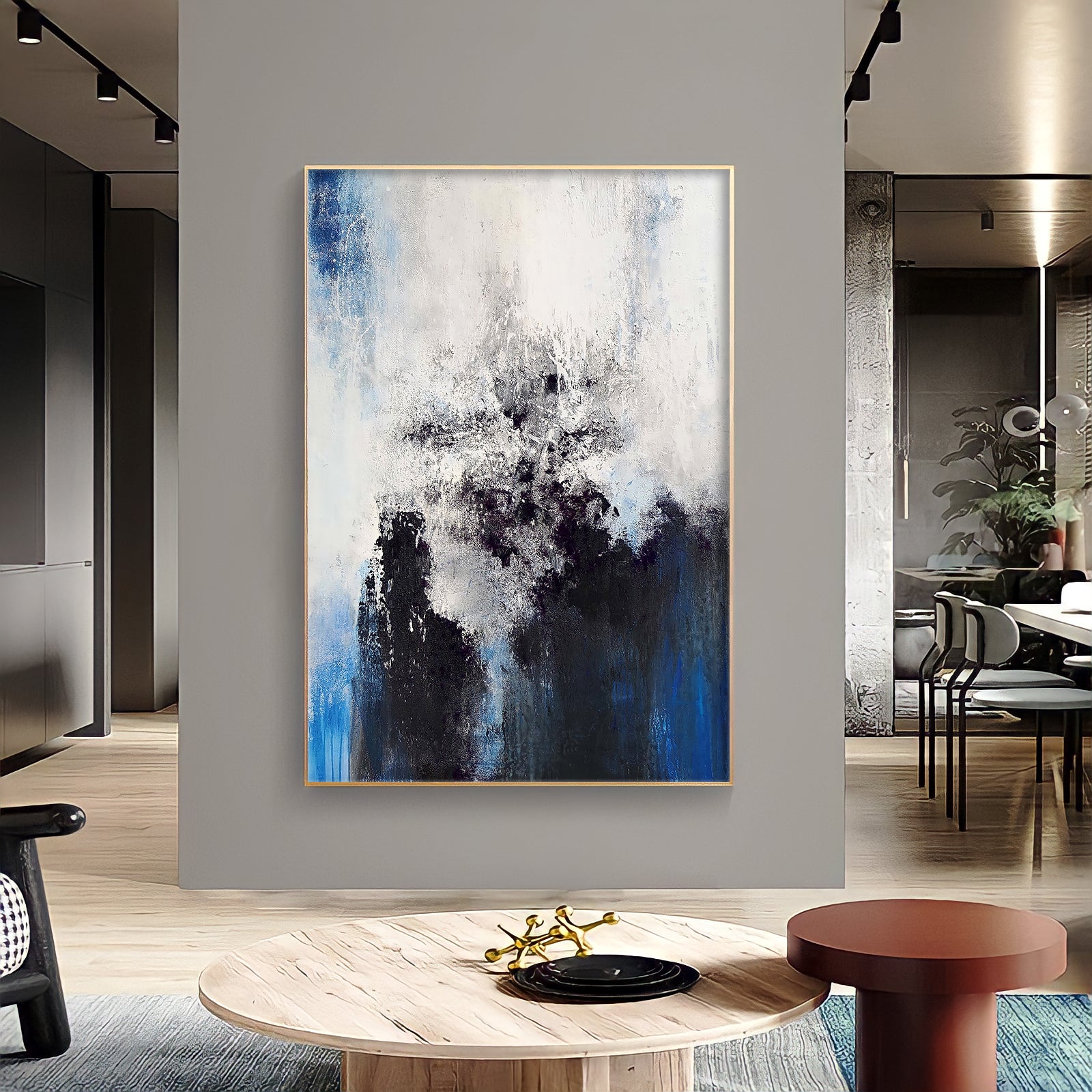 a painting hanging on a wall in a living room