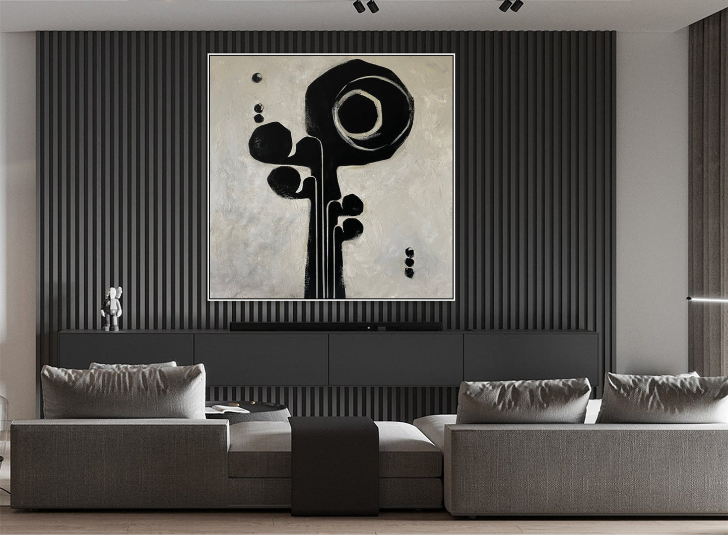 a living room with a couch and a painting on the wall