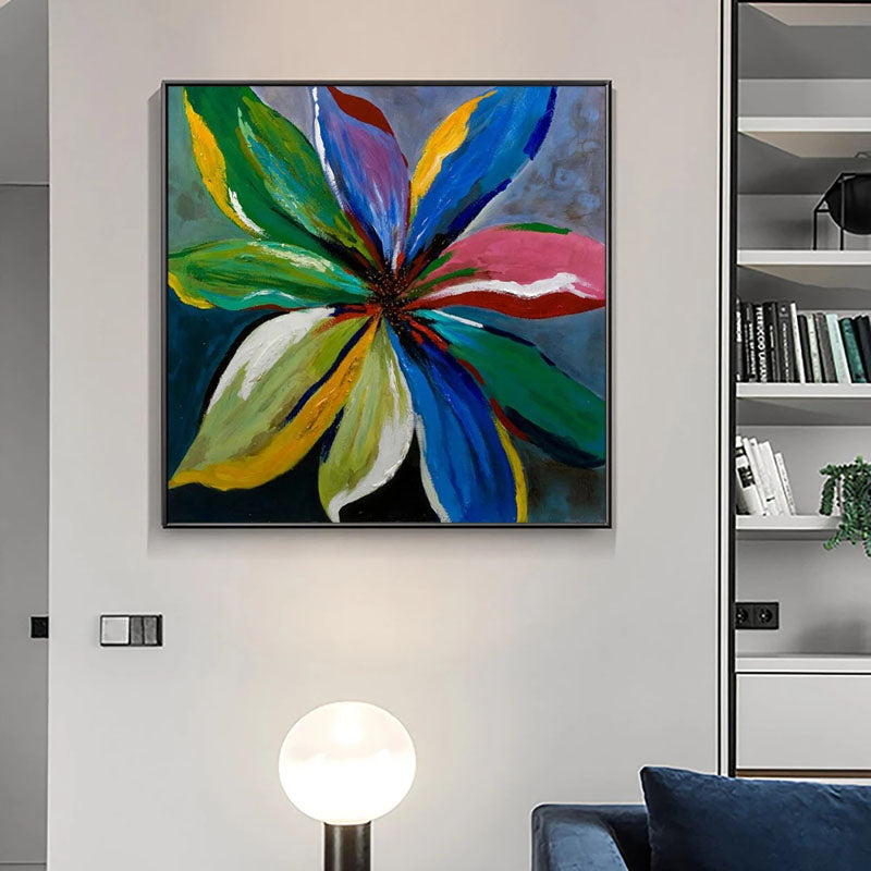 a living room with a couch and a painting on the wall