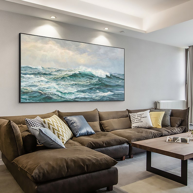 a living room with a large painting on the wall