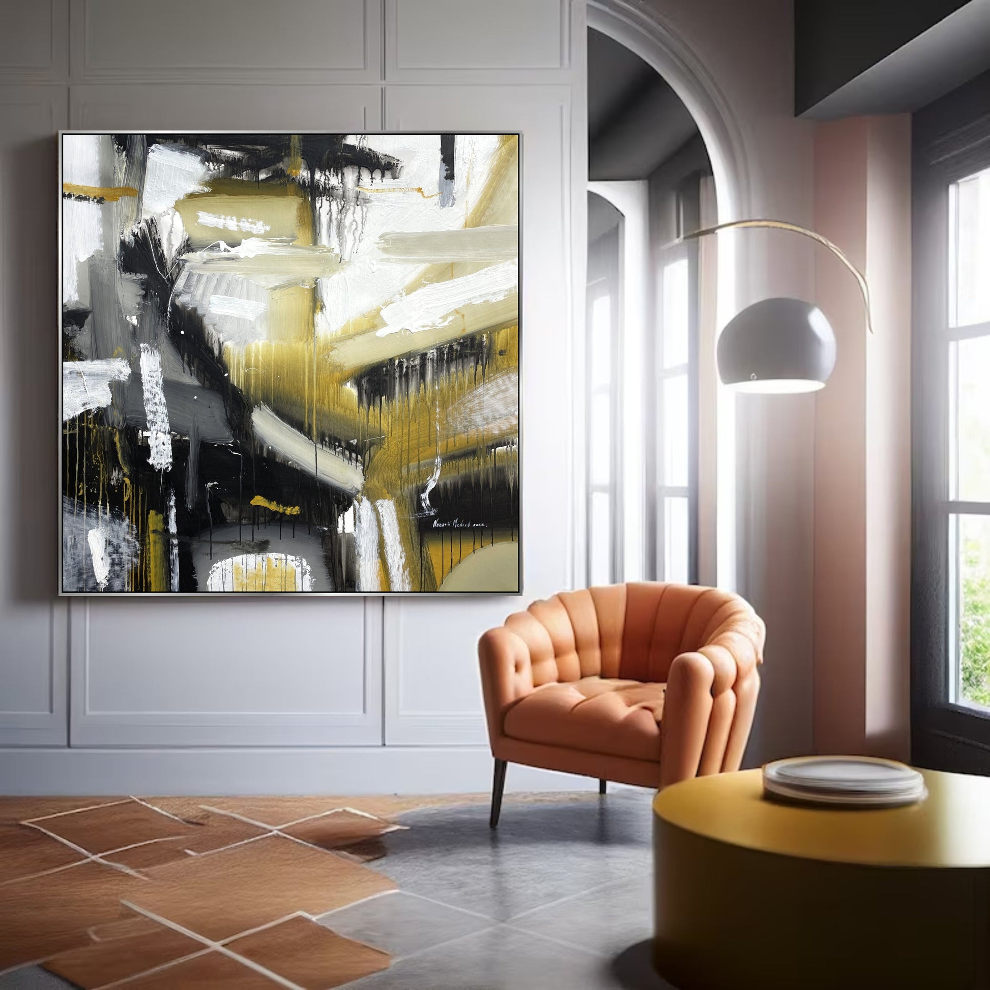 a living room with a chair and a painting on the wall