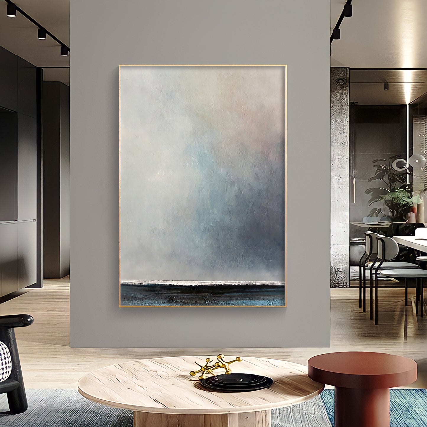 a living room with a large painting on the wall