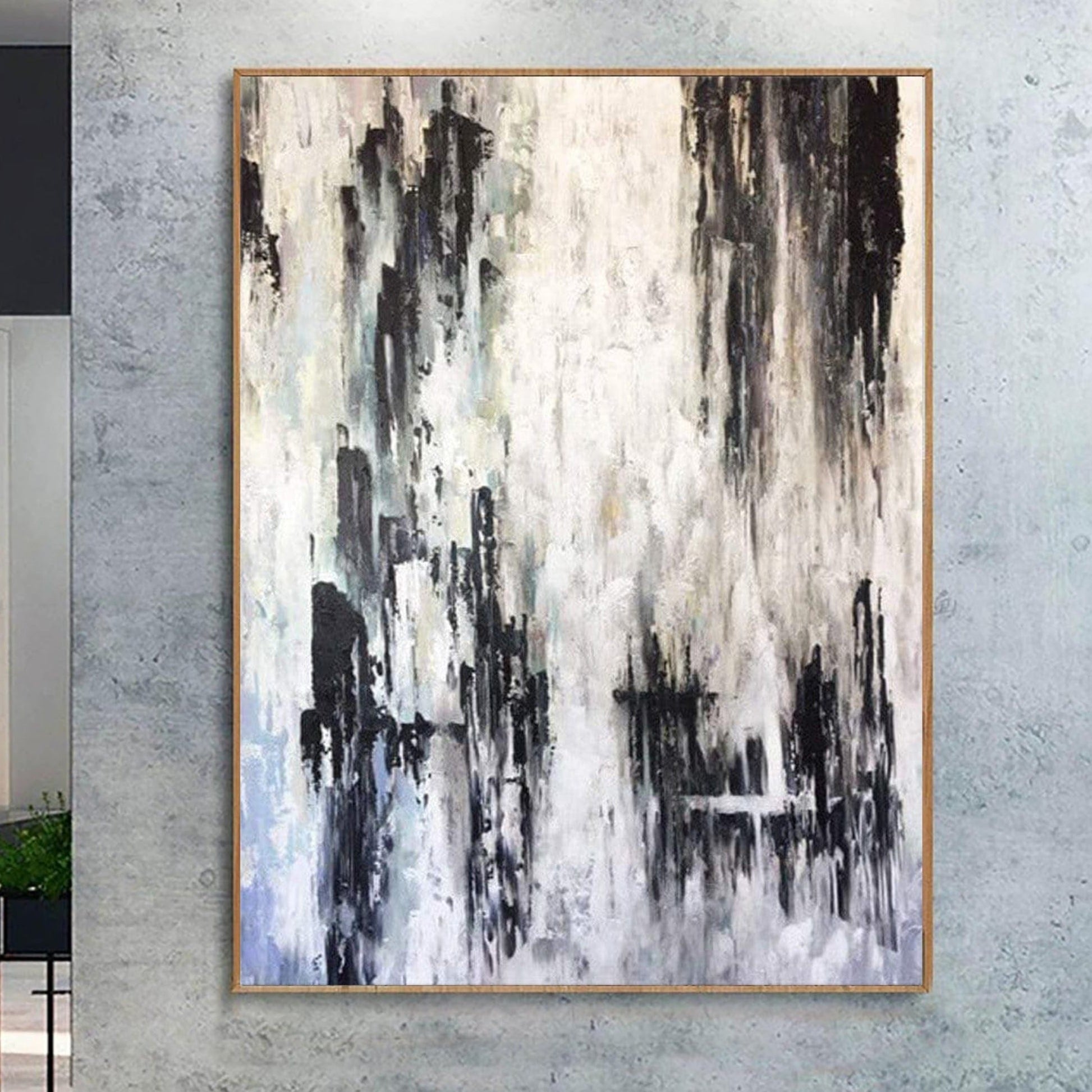 an abstract painting with a predominantly black and white color scheme, featuring vertical lines and brushstrokes that create a sense of movement and energy.