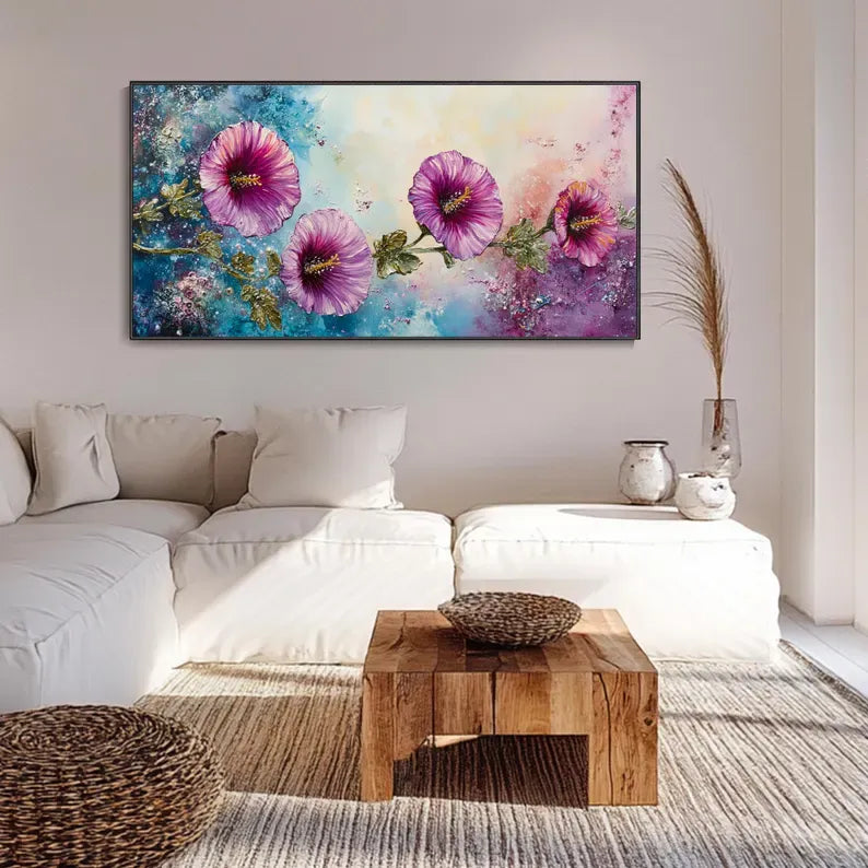 a large, colorful painting of flowers hanging on a wall above a white couch in a living room setting.
