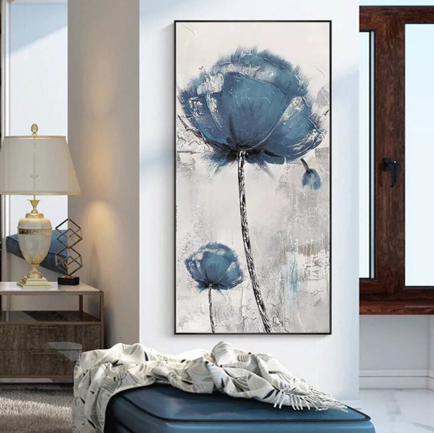 a painting of a blue flower on a white wall