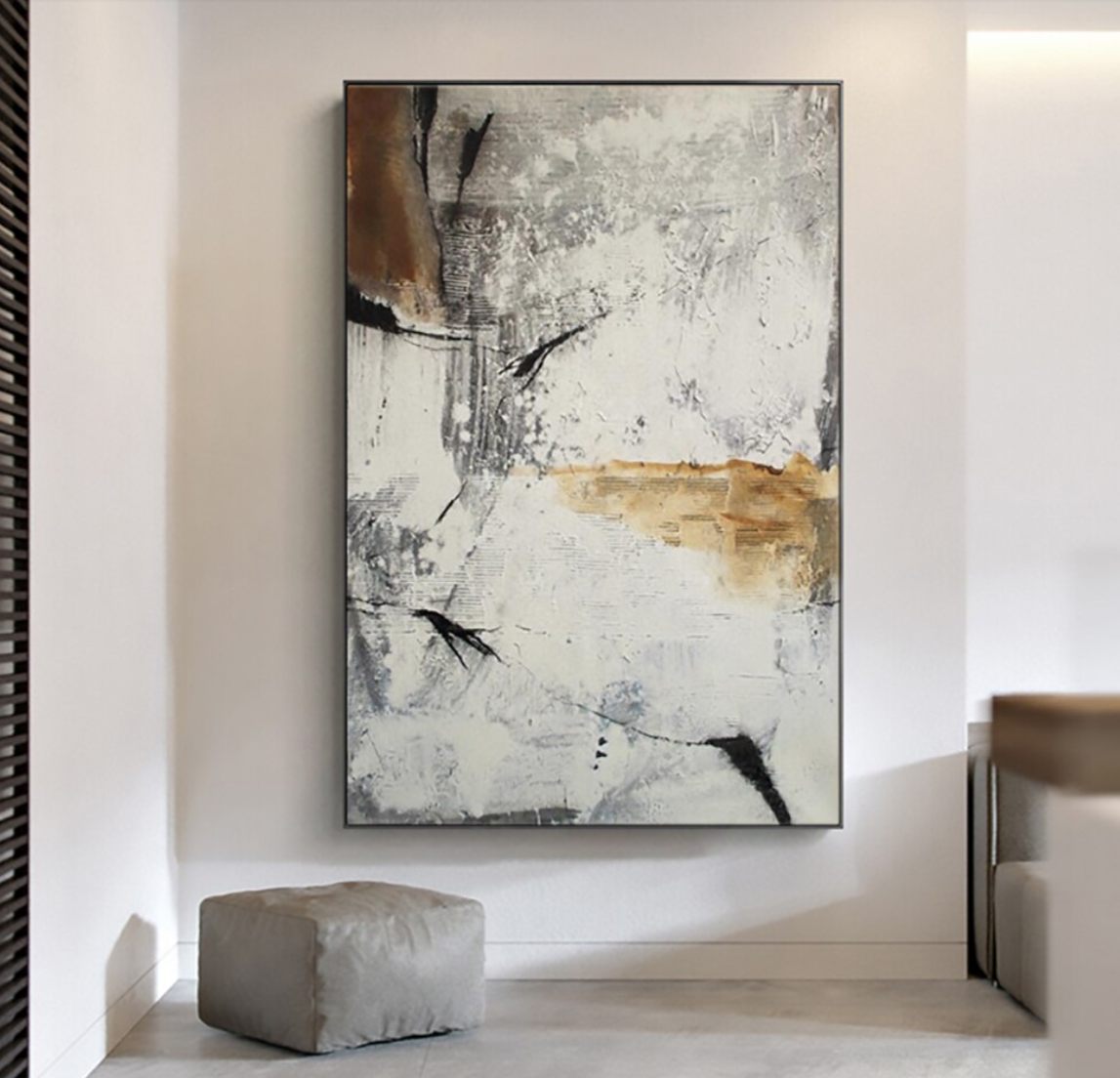 a painting hanging on a wall in a room