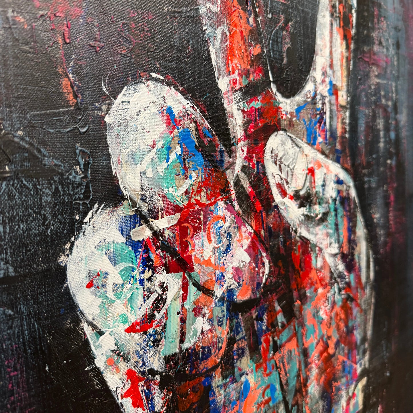 The image is a vibrant, abstract painting featuring a large, expressive hand in the center, with bold brushstrokes and a mix of colors including red, blue, green, and white.