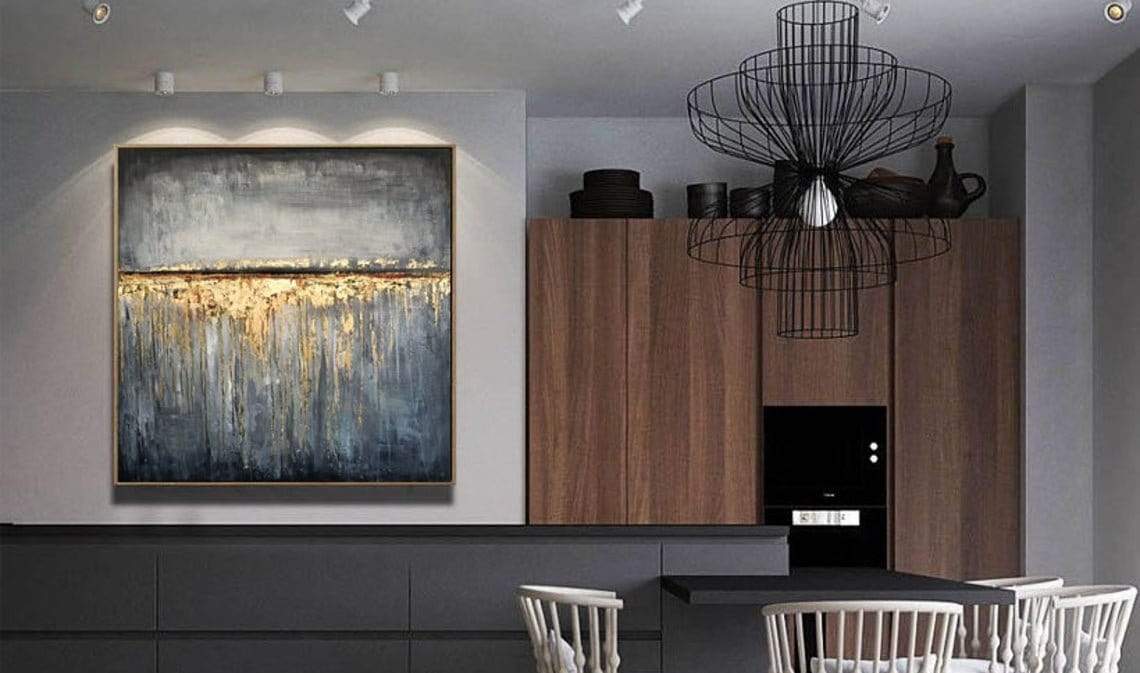 a painting hanging on the wall of a kitchen