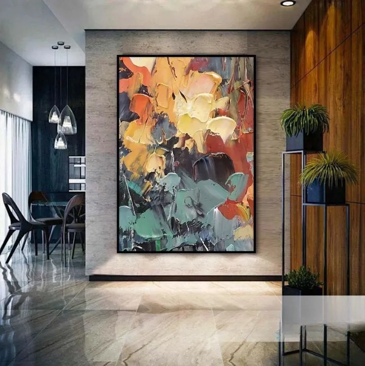a modern and stylish interior design with a large abstract painting hanging on the wall, surrounded by potted plants and a dining table.