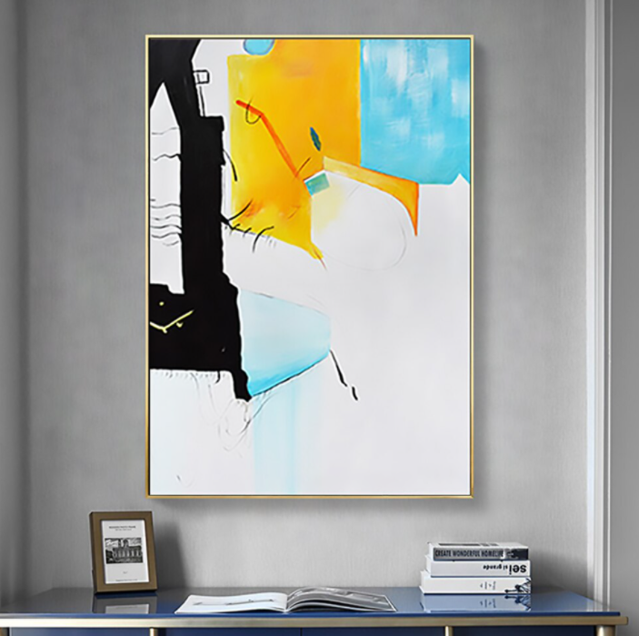 a painting hanging on a wall above a desk