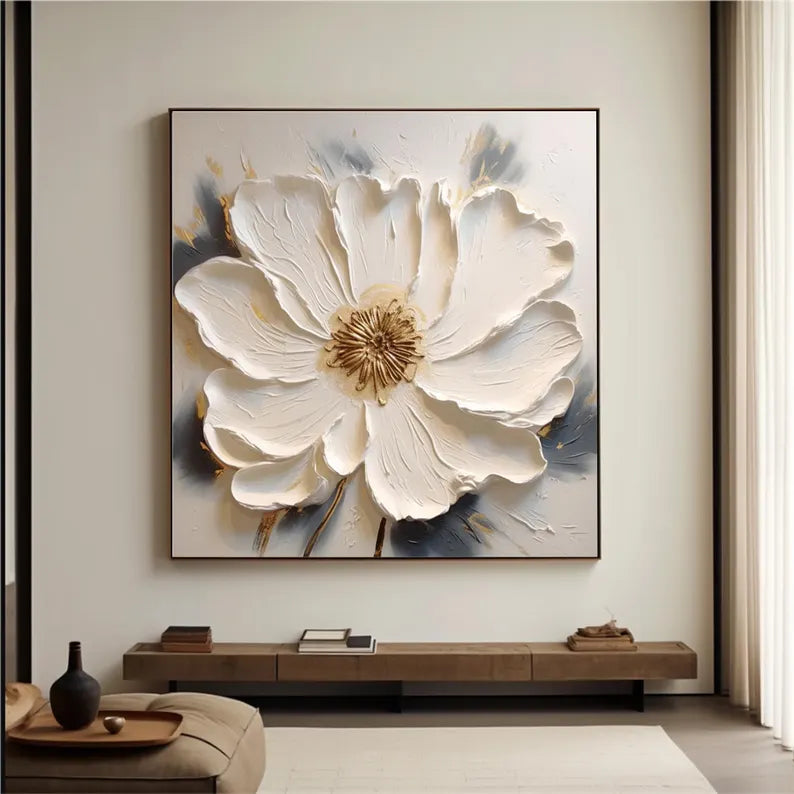 a living room with a large white flower on the wall