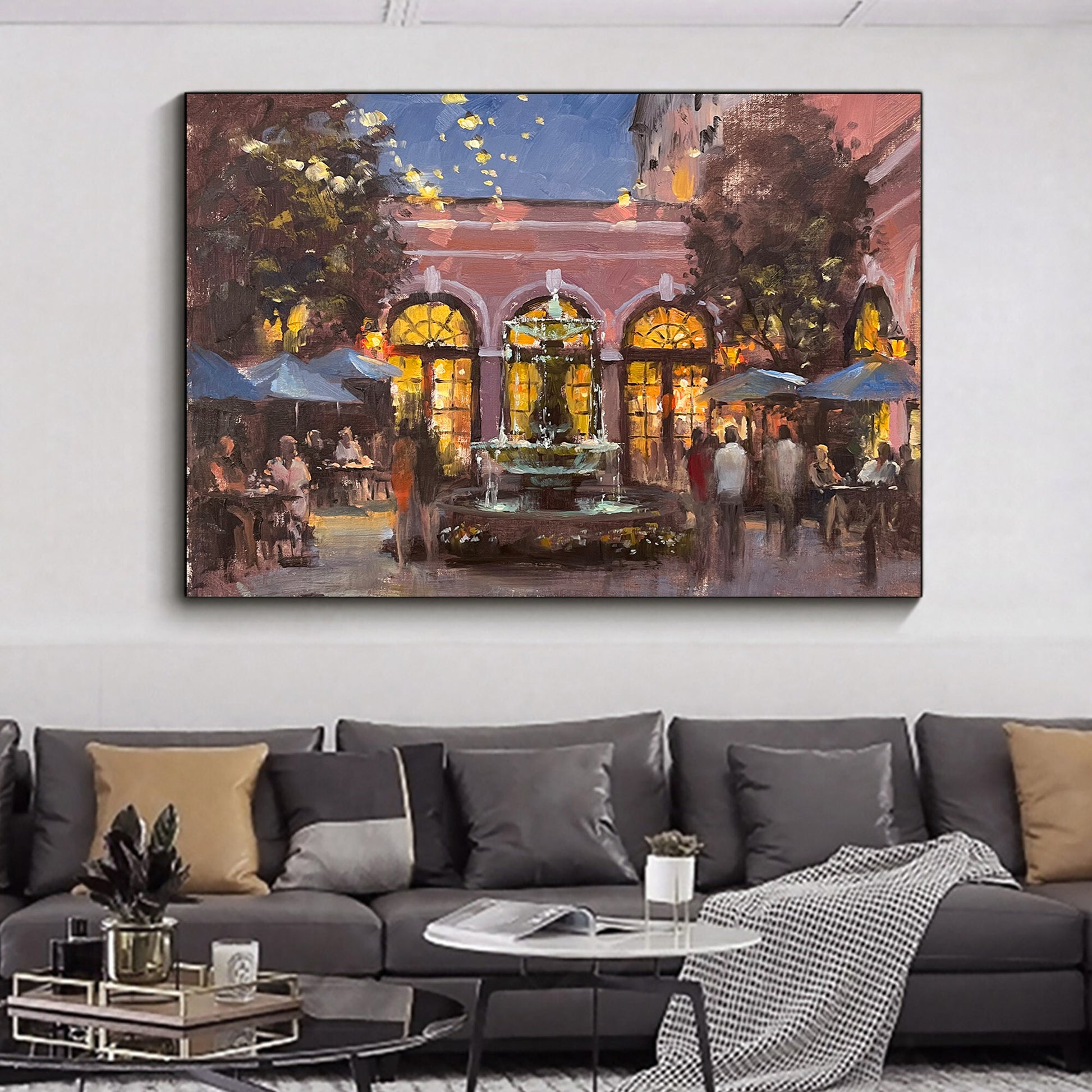 a living room with a couch and a painting on the wall