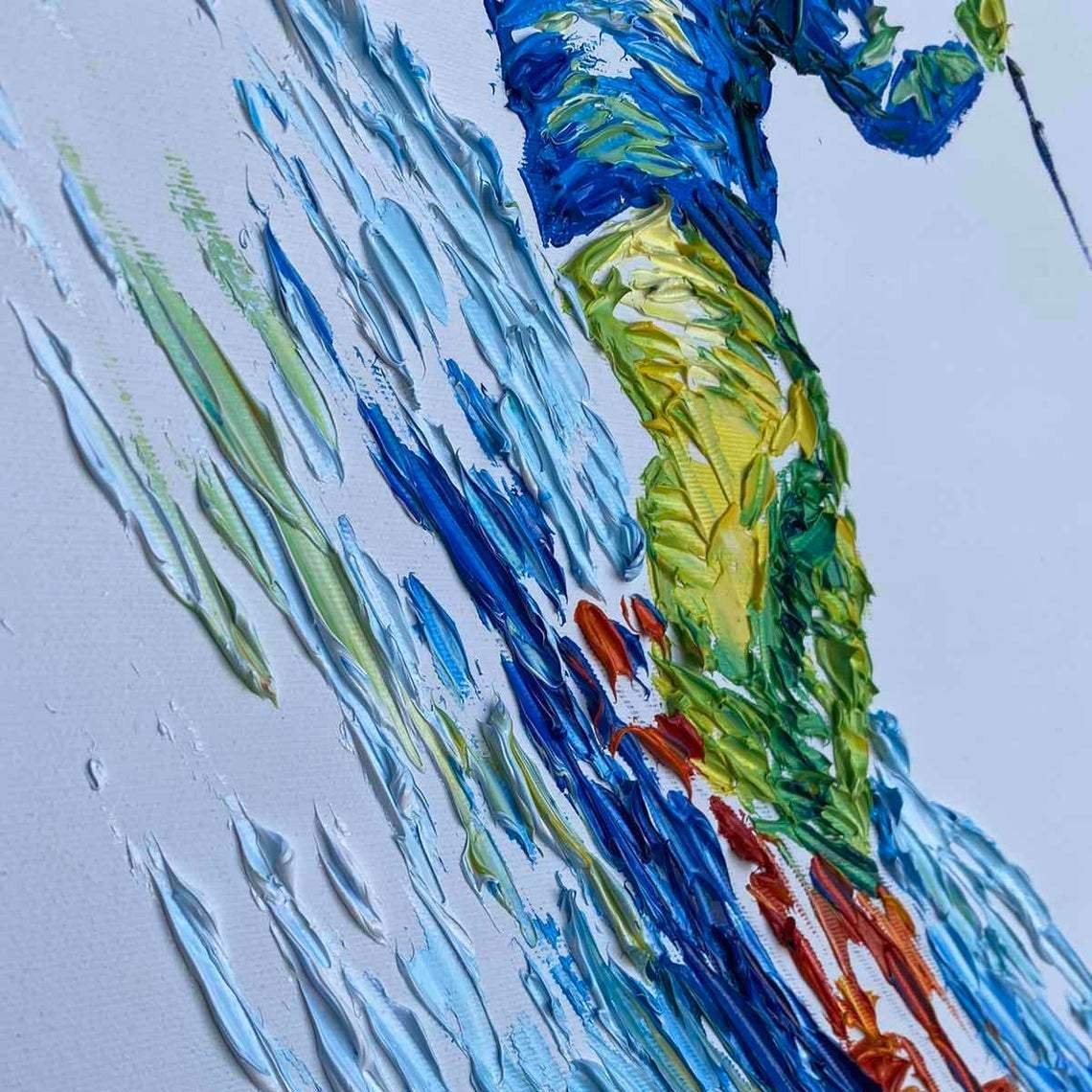 The image is a close-up of a painting depicting a person skiing down a snowy slope. The painting is done in an impressionistic style, with visible brushstrokes and a vibrant color palette.